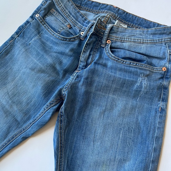 Mid Rise Tapered Distressed Slim Jeans - Picture 3 of 7